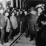 Mayor Seth Low holds a mallet, surrounded by a crowd of police, officials, and citizens at a dedication ceremony for a New York City subway station, probably the City Hall station, New York City, circa 1903. (Getty)<br/>